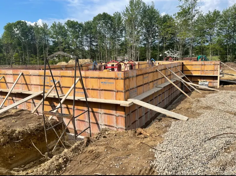 Foundation wall forms set and braced on a Boynton Brook site
