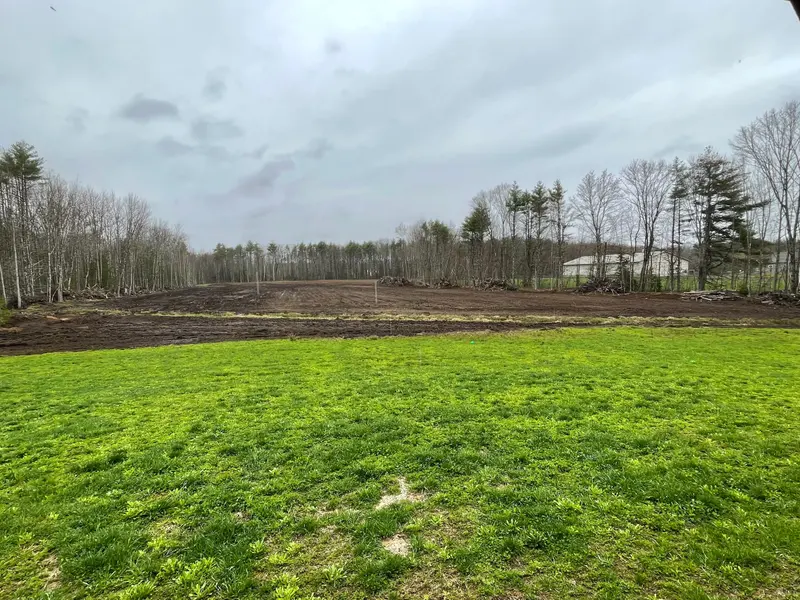 Freshly cleared and rough-graded field ready for loam and seed